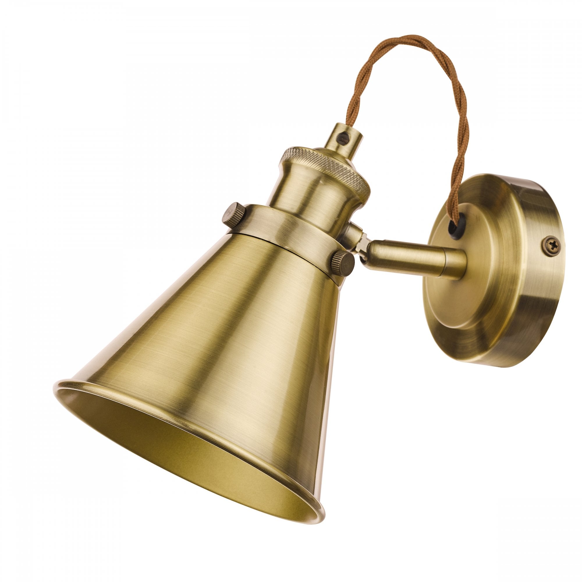 A close-up of an industrial brass cone wall light with a braided cable on a white background.