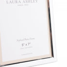 A close-up of the Laura Ashley Neyland 5" x 7" photo frame with product details.