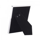 The back of a shiny silver photo frame showing a black velvet stand on white background.