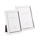 Two shiny silver Laura Ashley photo frames, one 4" x 6" and one 5" x 7".