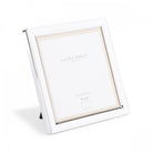 A white 5" x 5" photo frame by Laura Ashley is displayed with a stand.