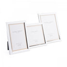 A trio of silver photo frames in varying sizes, artfully arranged together.