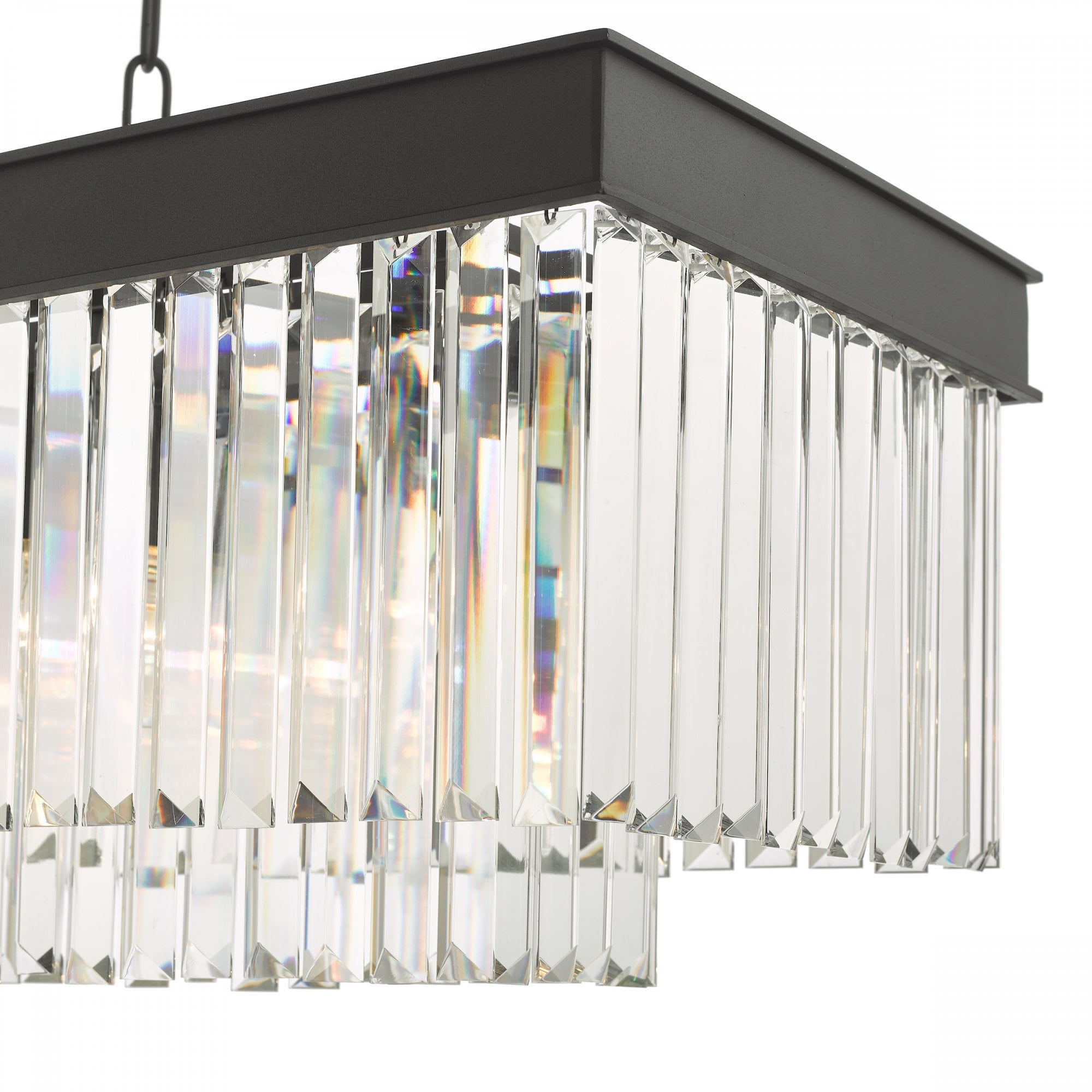 Close-up of the tiered clear crystal rods and black frame of a rectangular chandelier.