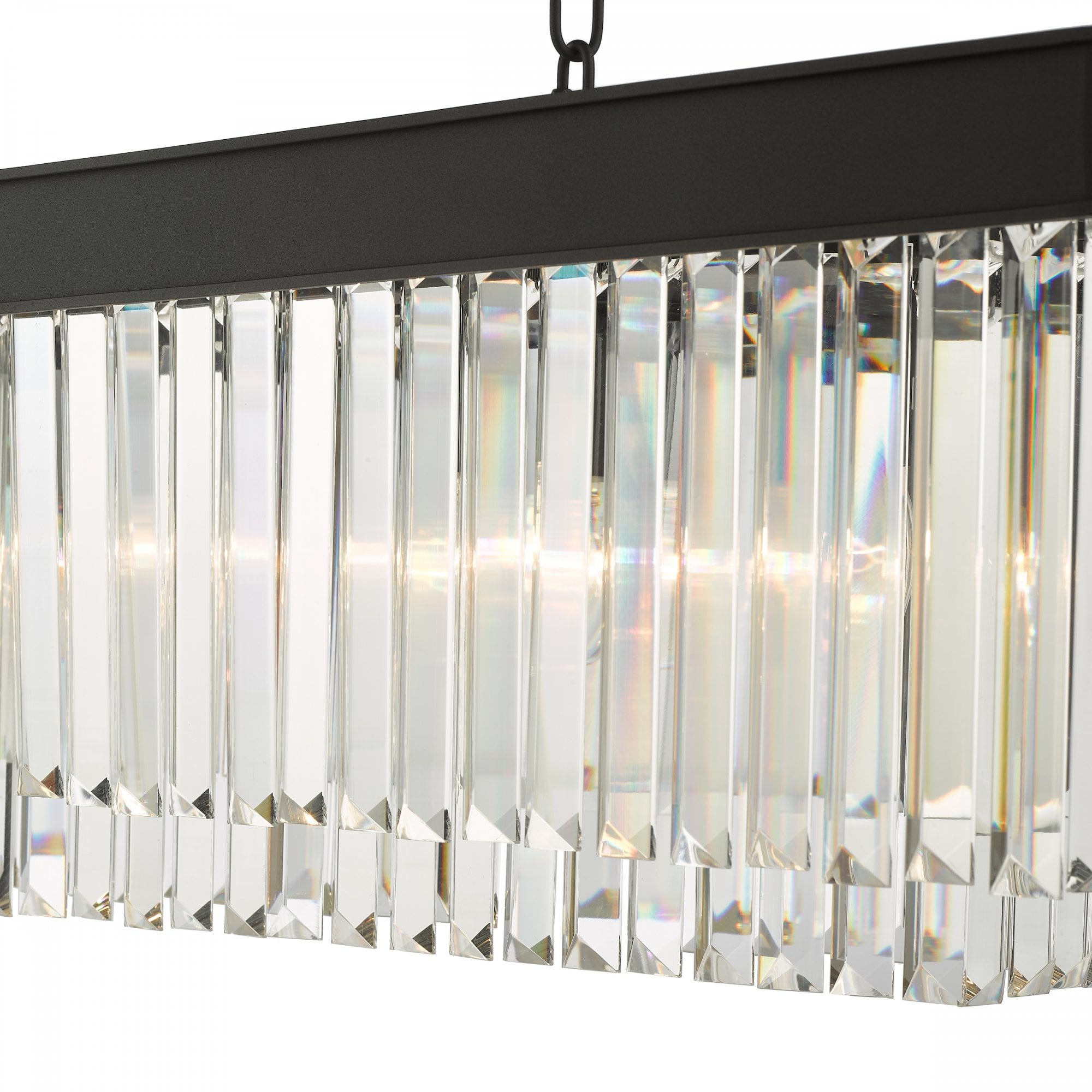 Close-up of the illuminated clear crystal rods and black frame of a rectangular chandelier.