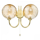 Brass wall light with two amber textured glass spheres and a pull cord switch.