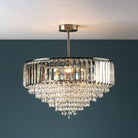 A stunning close-up of a tiered crystal chandelier with light illuminating its facets.