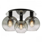 Modern ceiling light with three smoked glass globes and exposed filament bulbs.