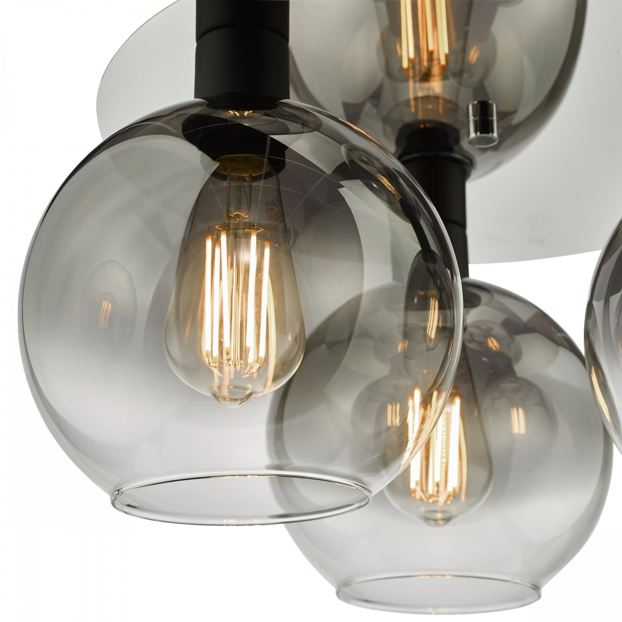 Close-up of a smoked glass globe and exposed filament bulb on a modern ceiling light.