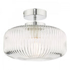 A close-up view of the ribbed glass flush ceiling light with a chrome fixture, unlit.