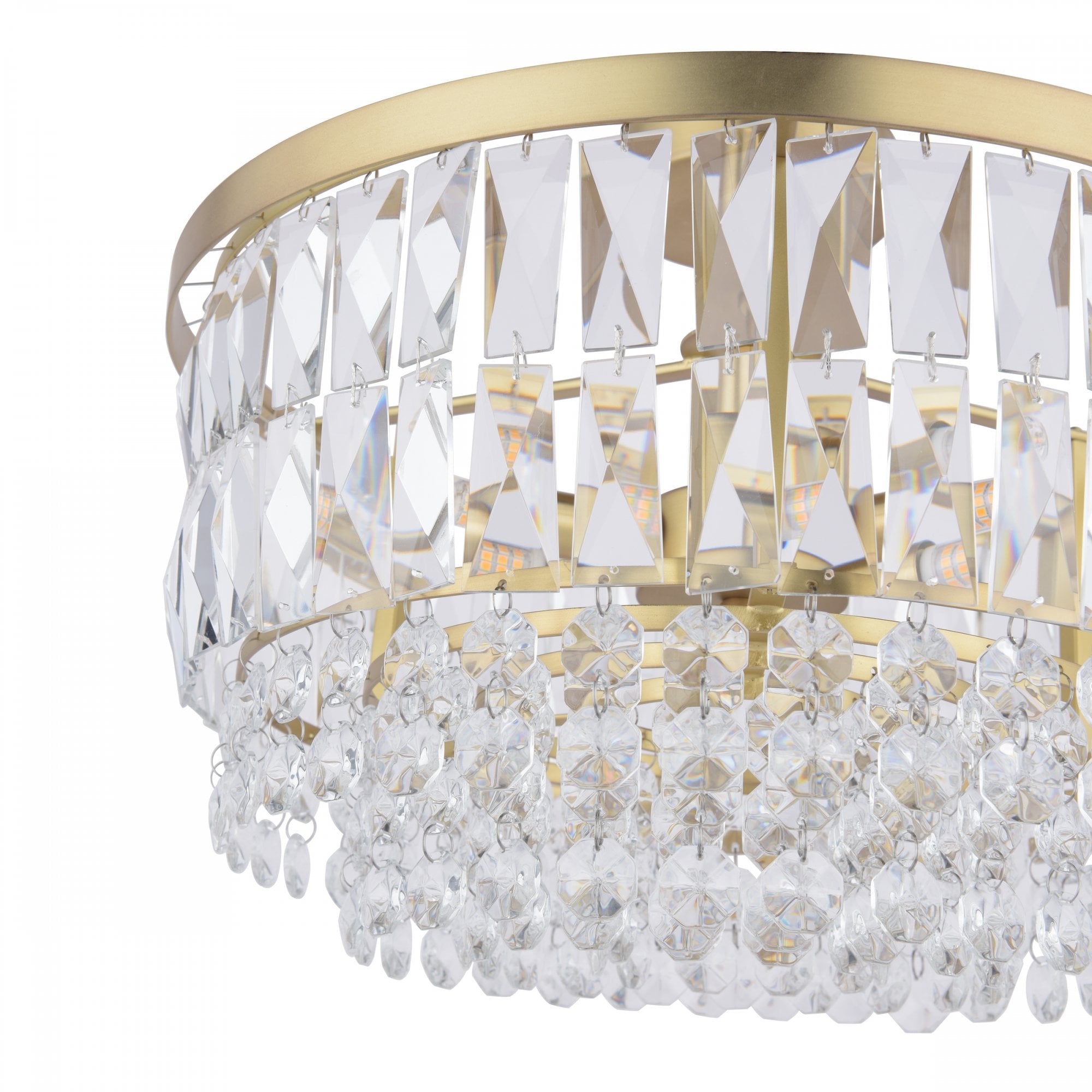 Close-up view of the bottom and side of a crystal chandelier with gold details.