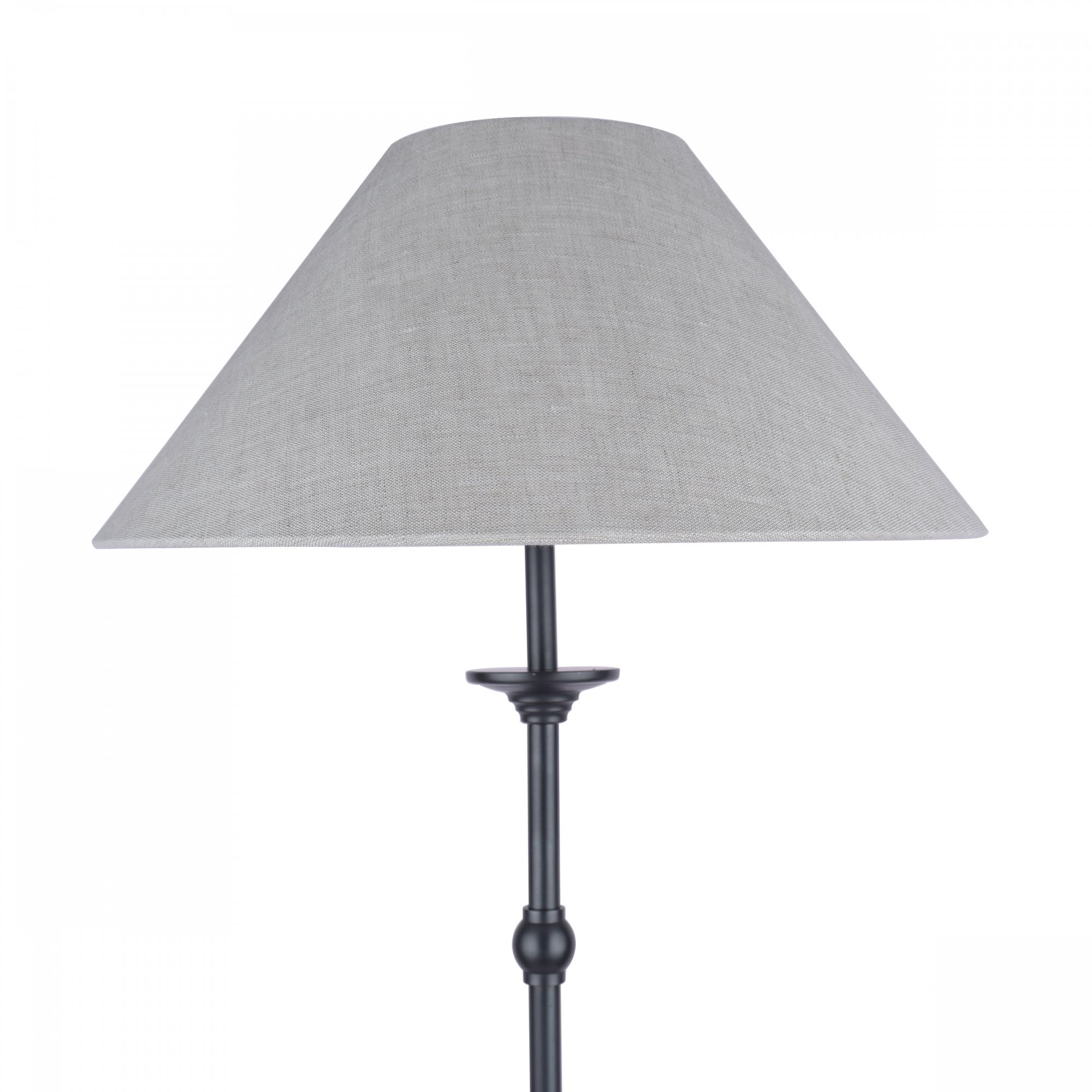 The top half of a classic floor lamp with a dark base and a light-colored tapered shade.