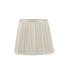 A single white pleated lampshade on a white background.