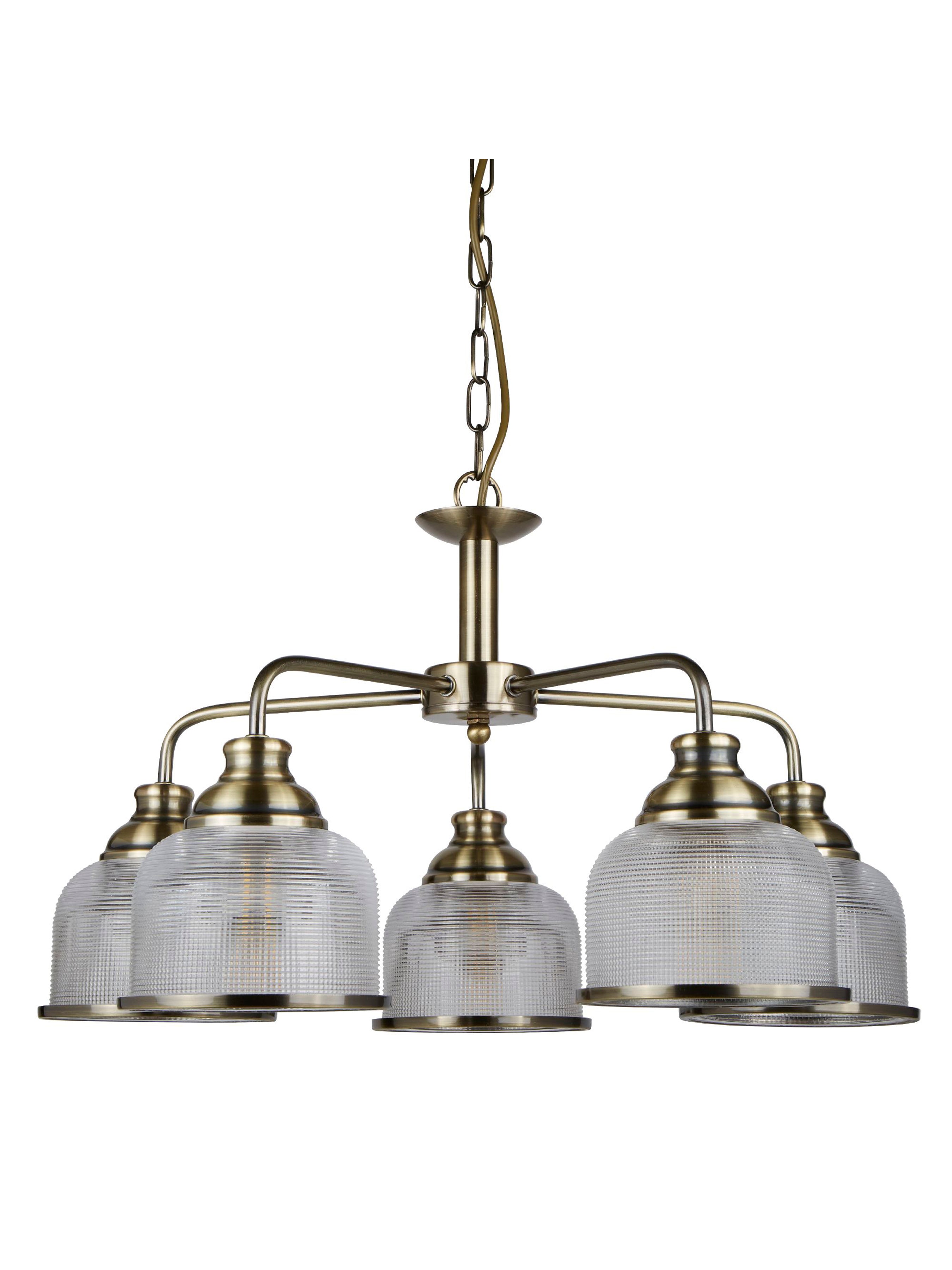 A five-arm antique brass chandelier with speckled clear glass shades.