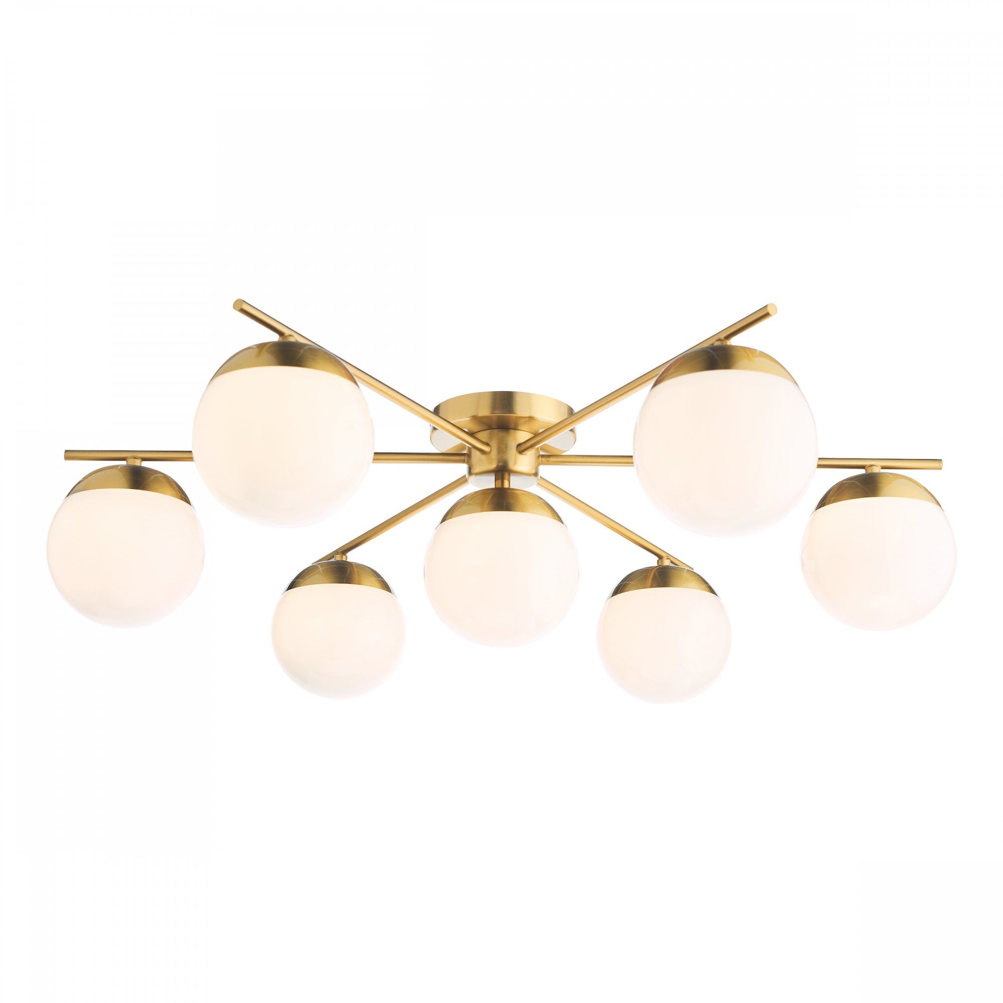 Seven-light ceiling fixture with white globe shades and a brass finish.
