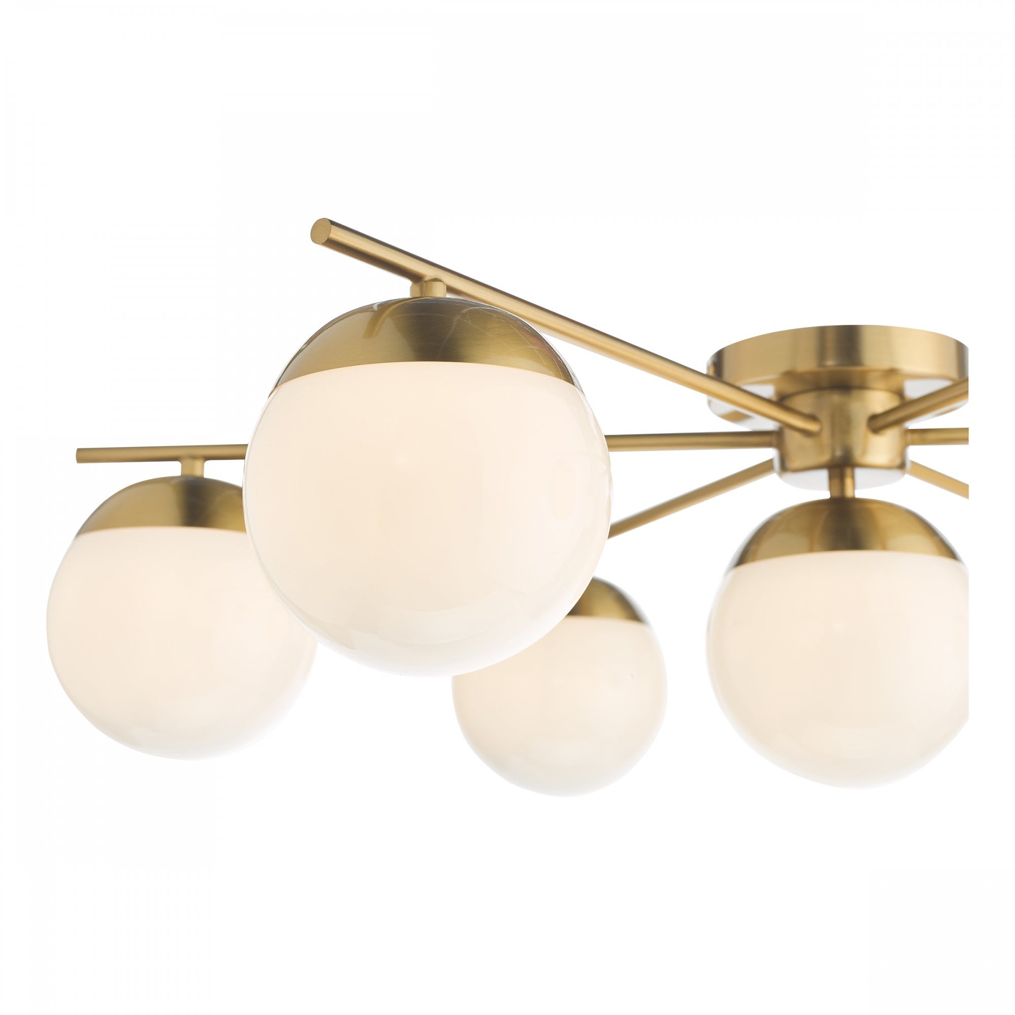 Close-up of a brass ceiling light fixture with five white globe shades.