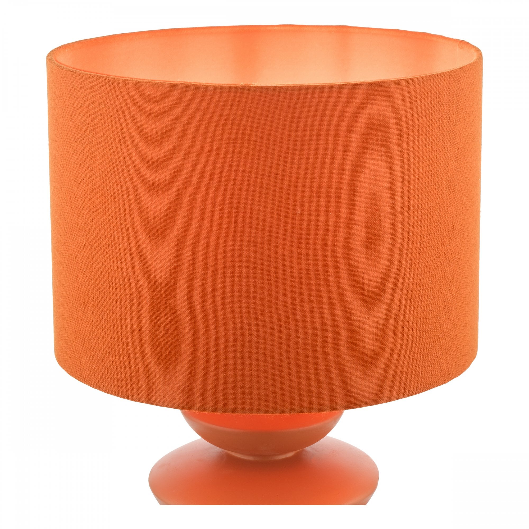 Close-up of an orange table lamp, featuring a textured cylindrical shade and stacked base.