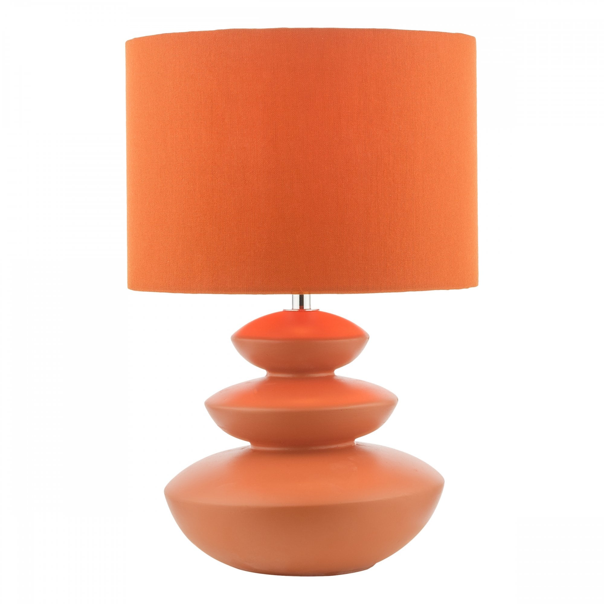 An orange table lamp with a three-tiered base, creating a cozy ambiance.