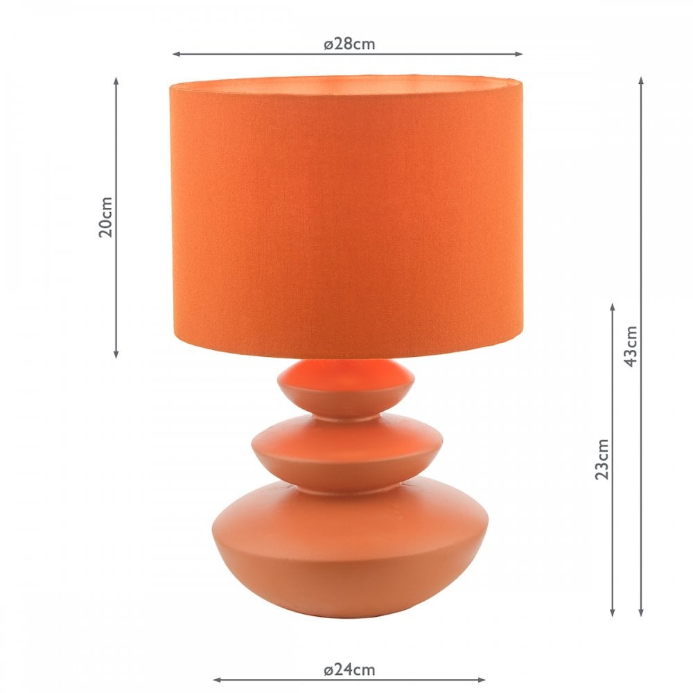 Dimensions of an orange table lamp with a three-tiered base, showing its size.