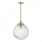 A clear, ribbed glass globe pendant light with brass accents and chain, hanging on a white background.