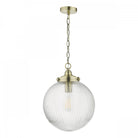 A clear, ribbed glass globe pendant light with brass accents and chain, hanging on a white background.