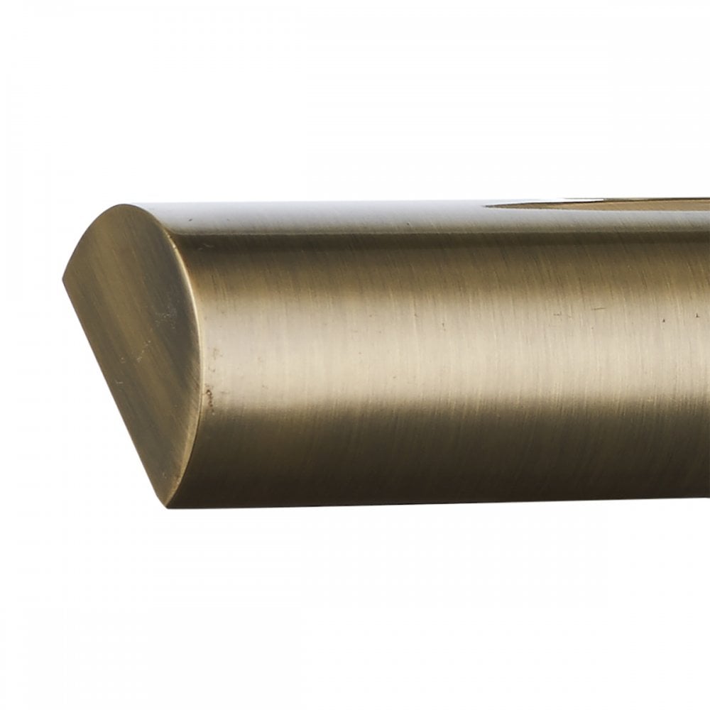 A close-up of the brass linear light shade's angled end.