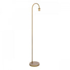 A minimalist golden floor lamp with a curved top and a circular base.