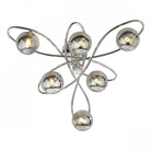 A close-up of a modern ceiling light with six smoked glass orbs on chrome swirls.