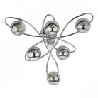 A modern ceiling light with six smoked glass orbs on chrome swirls on a white background.