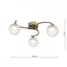 A three-light ceiling fixture with ribbed spherical shades, antique brass finish, and dimensions.