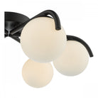Detailed view of the modern ceiling light showing its black frame and white globe diffusers.