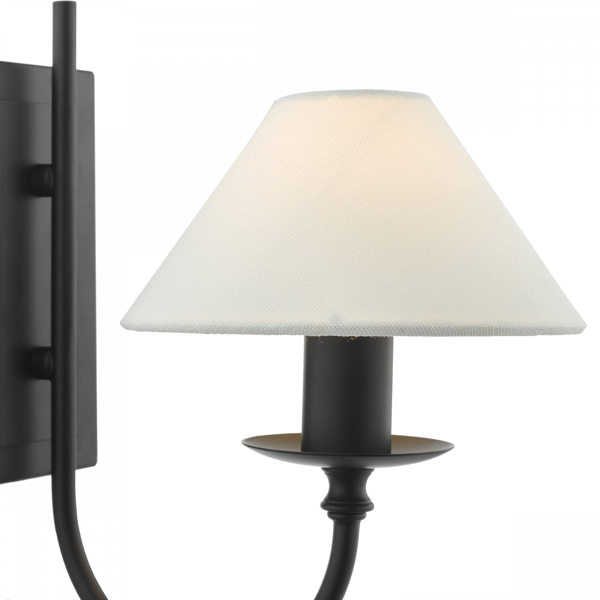 A close-up of a black wall sconce with a white conical shade.