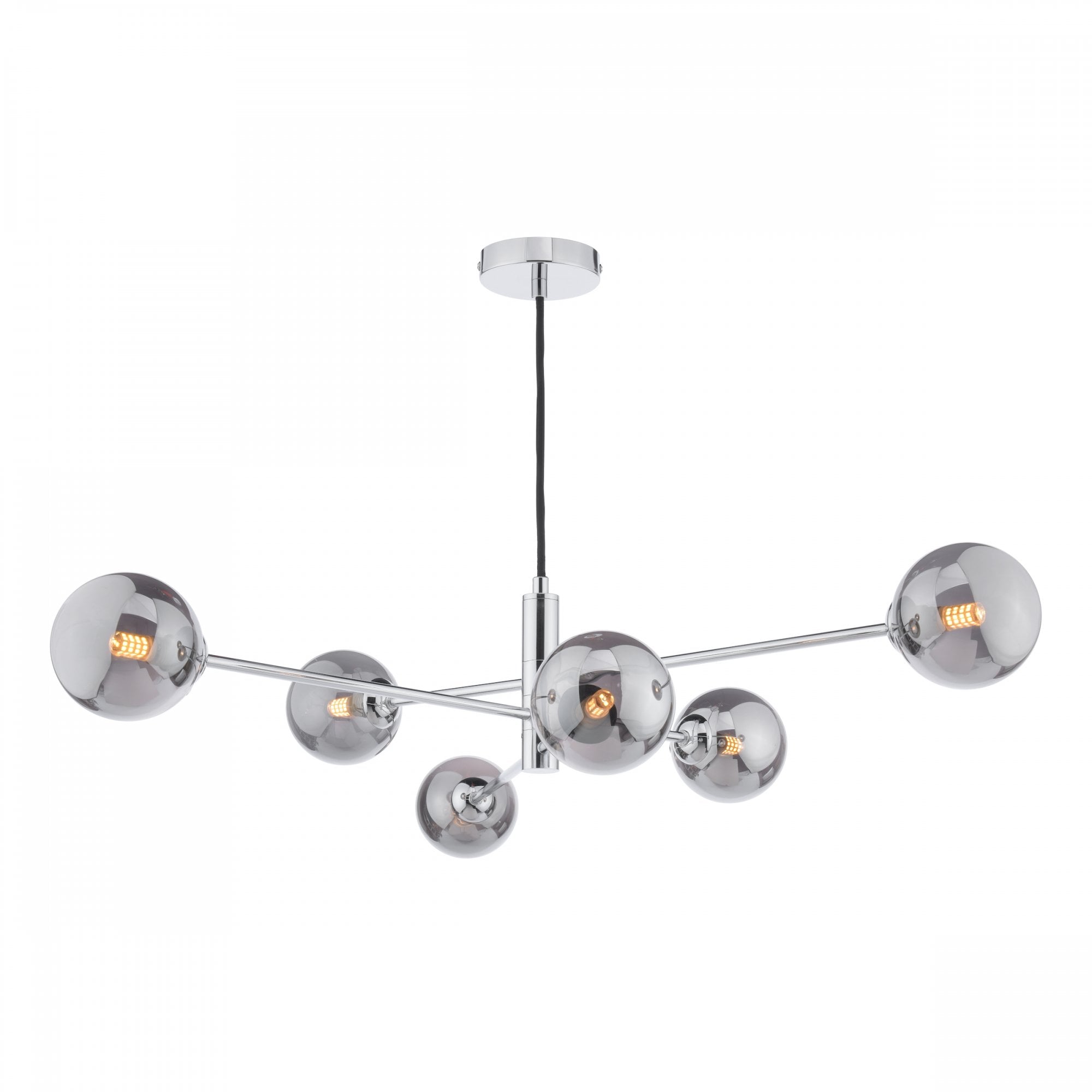 A modern chrome chandelier with six smoked glass globes, casting a warm glow.