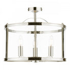 A close-up of a semi-flush chrome ceiling light with a clear glass shade.