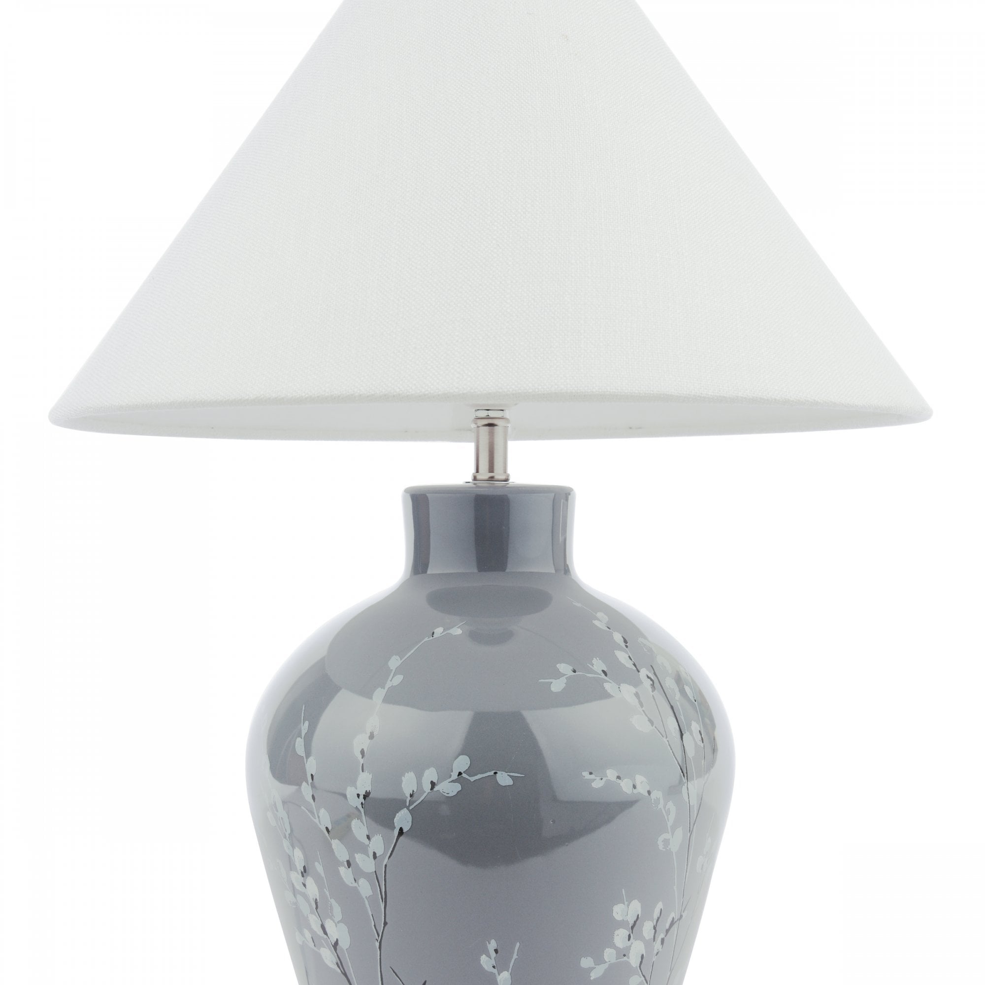 A white tapered lampshade on a grey base with white flowers on a white background.