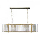 A frontal shot of the rectangular chandelier, showcasing its gold frame and clear glass rods.