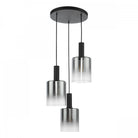A sleek black chandelier with three smoked glass cylindrical shades on a white background.