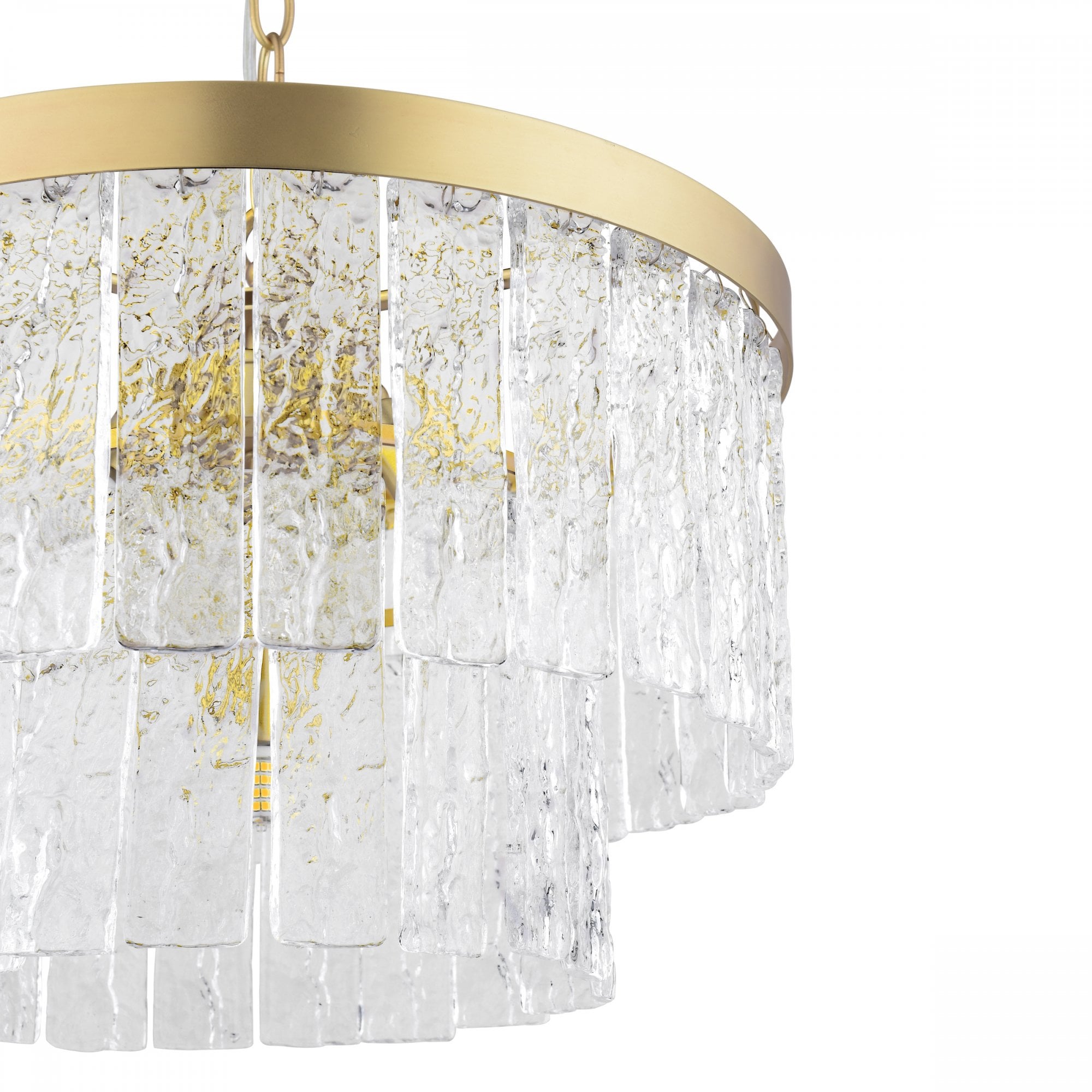 A close-up view of the textured glass tiers of the chandelier with a brass ring.