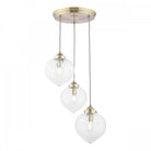 Three clear glass pendant lights with brass fittings on a white background.