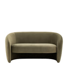 Front view of a minimalist sage green velvet sofa with rounded arms and back.