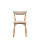 A light wood dining chair with a cream upholstered seat and back on a white background.