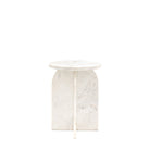 A white marble side table with an arched base and a round top.