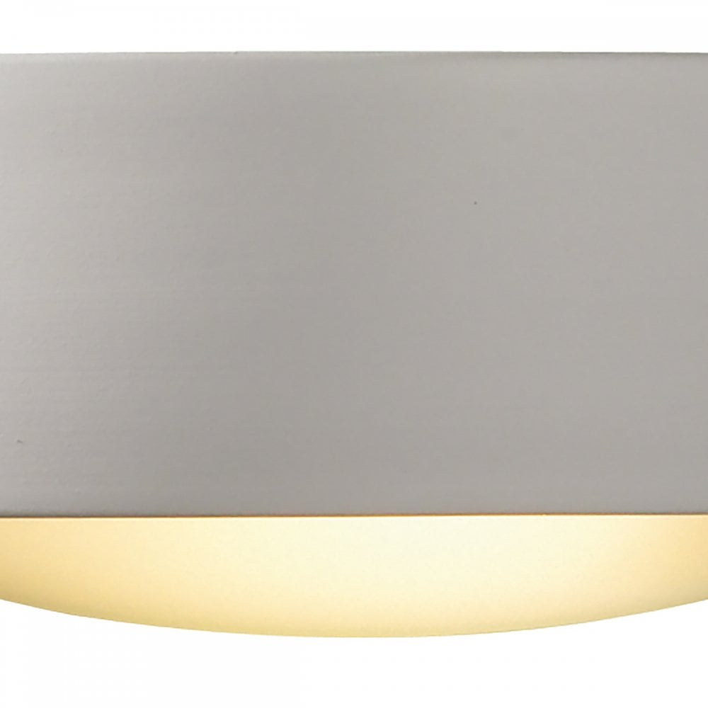 Close-up of a white rectangular wall light with a curved base, emitting a warm glow.
