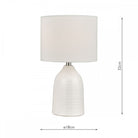 A white ceramic table lamp with a drum shade and dimensions of 32cm height and 18cm diameter.
