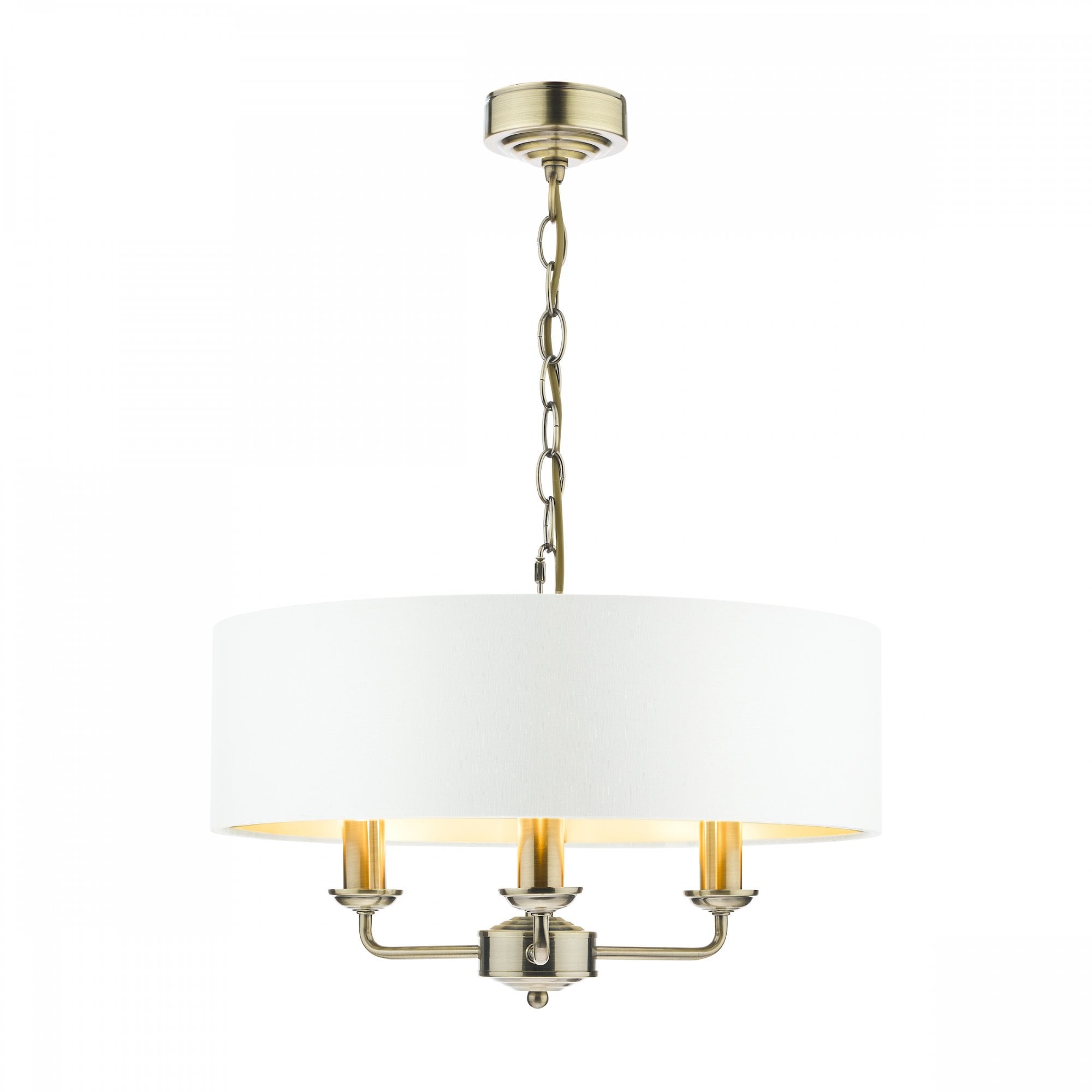 A brass three-arm pendant light with a white drum shade against a white background.
