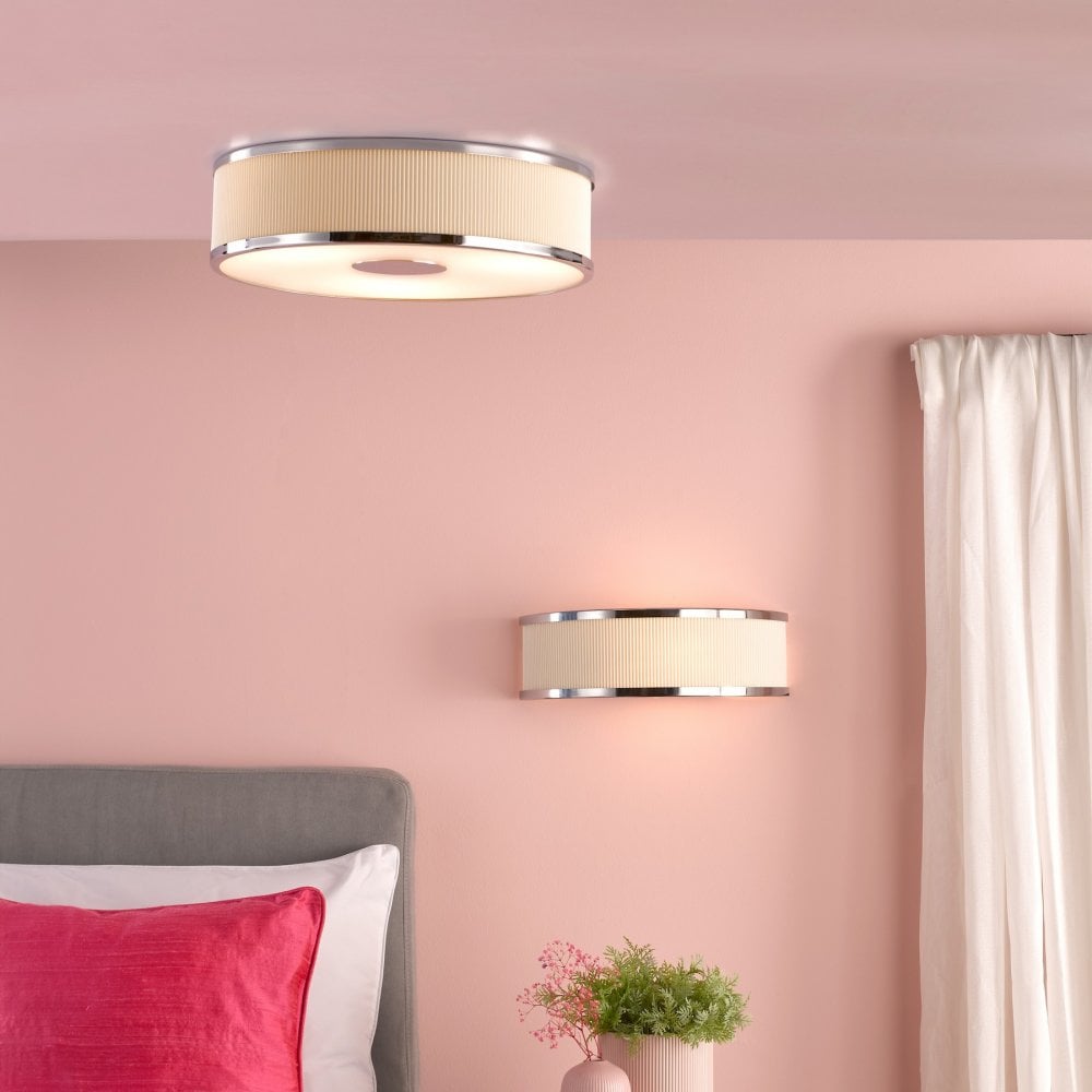 A bedroom with matching wall and ceiling lights, creating a cohesive and warm ambiance.
