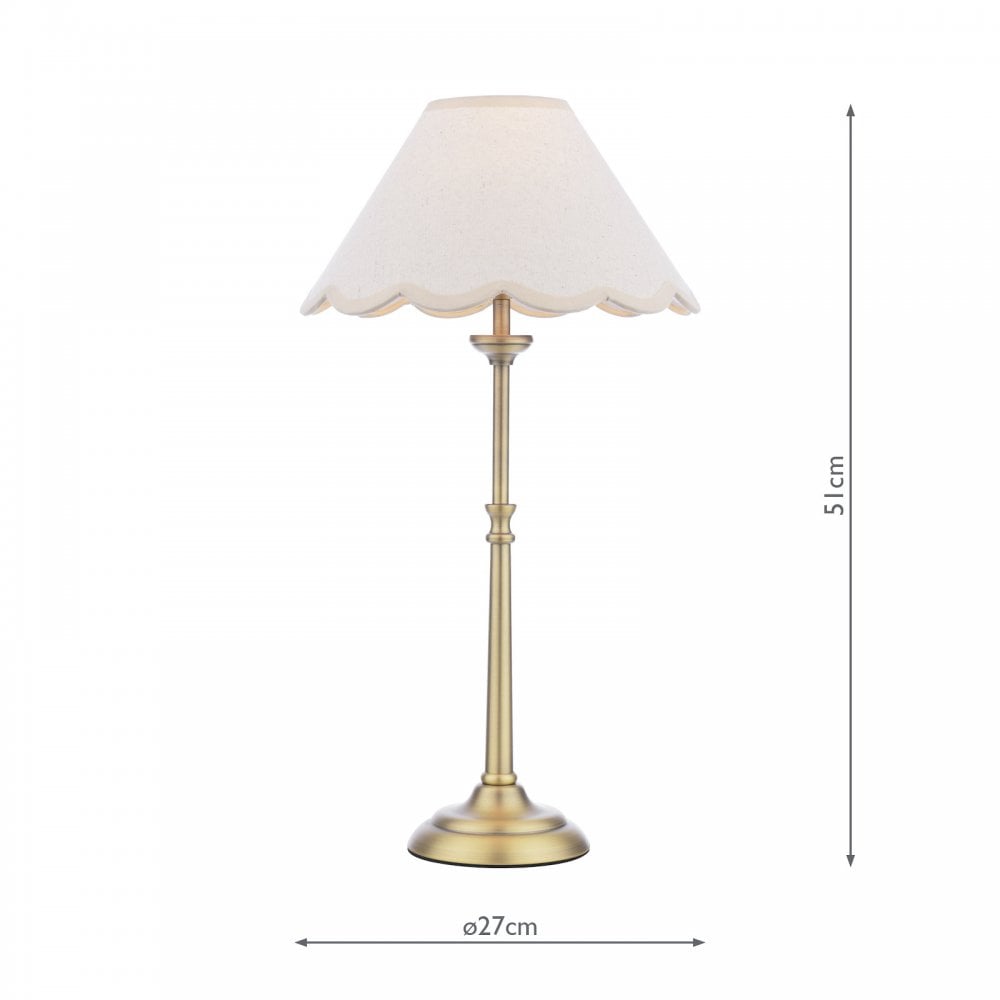 A brass table lamp with a cream scalloped shade, with dimensions displayed.