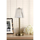 Bronze rechargeable table lamp with a pleated clear plastic shade.