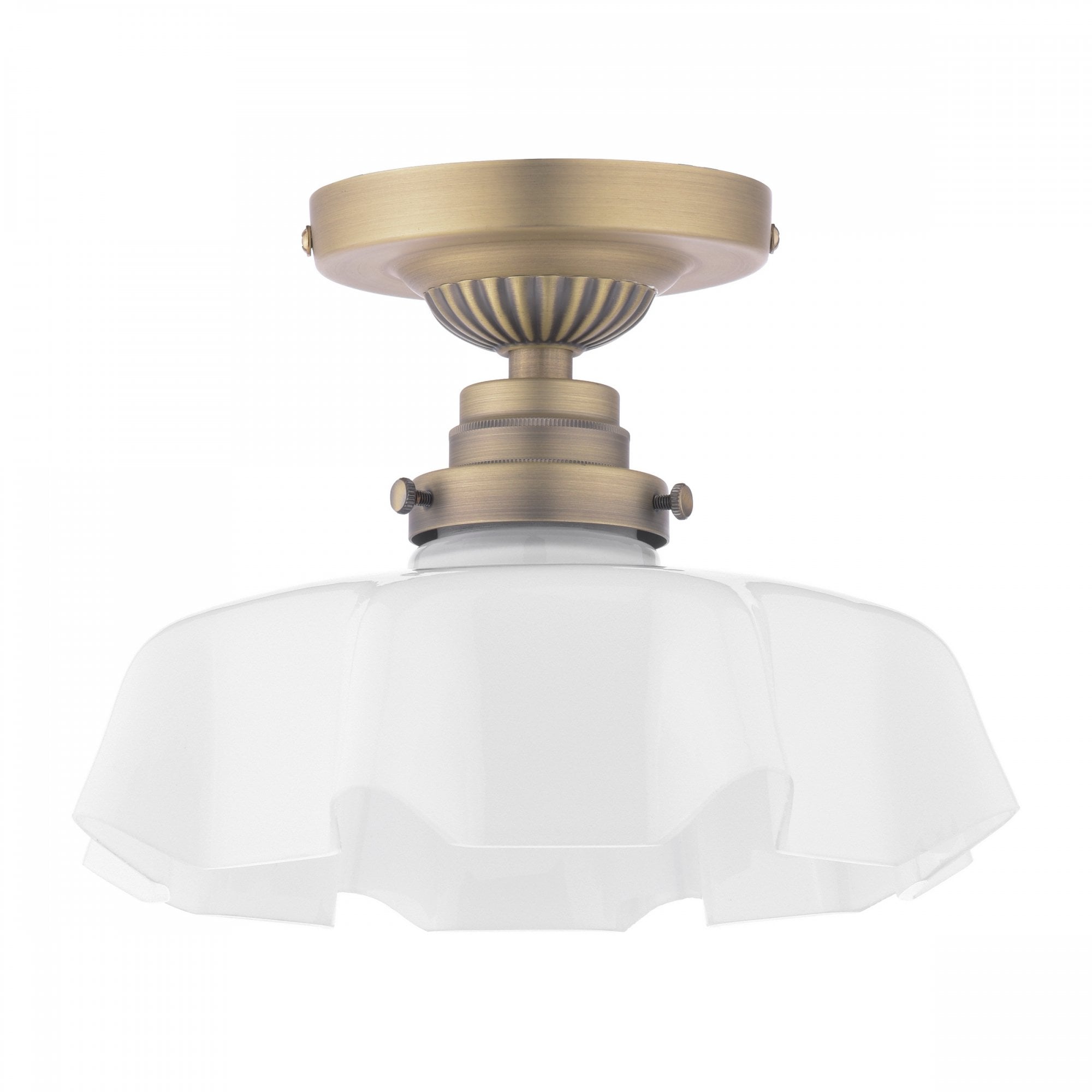 A close-up of a brass ceiling light with a ruffled, translucent glass shade.