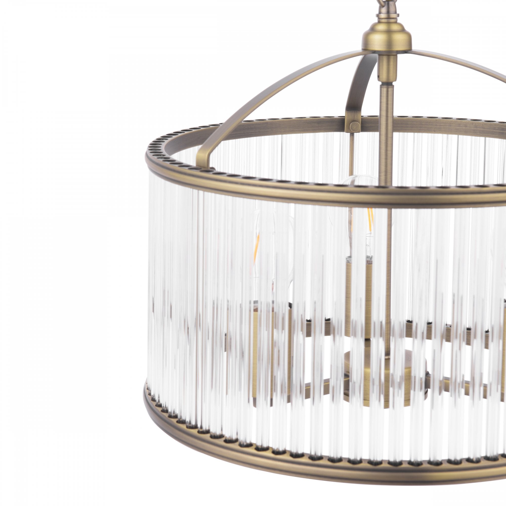 A close-up of the antique brass and reeded glass shade of the pendant light fixture.