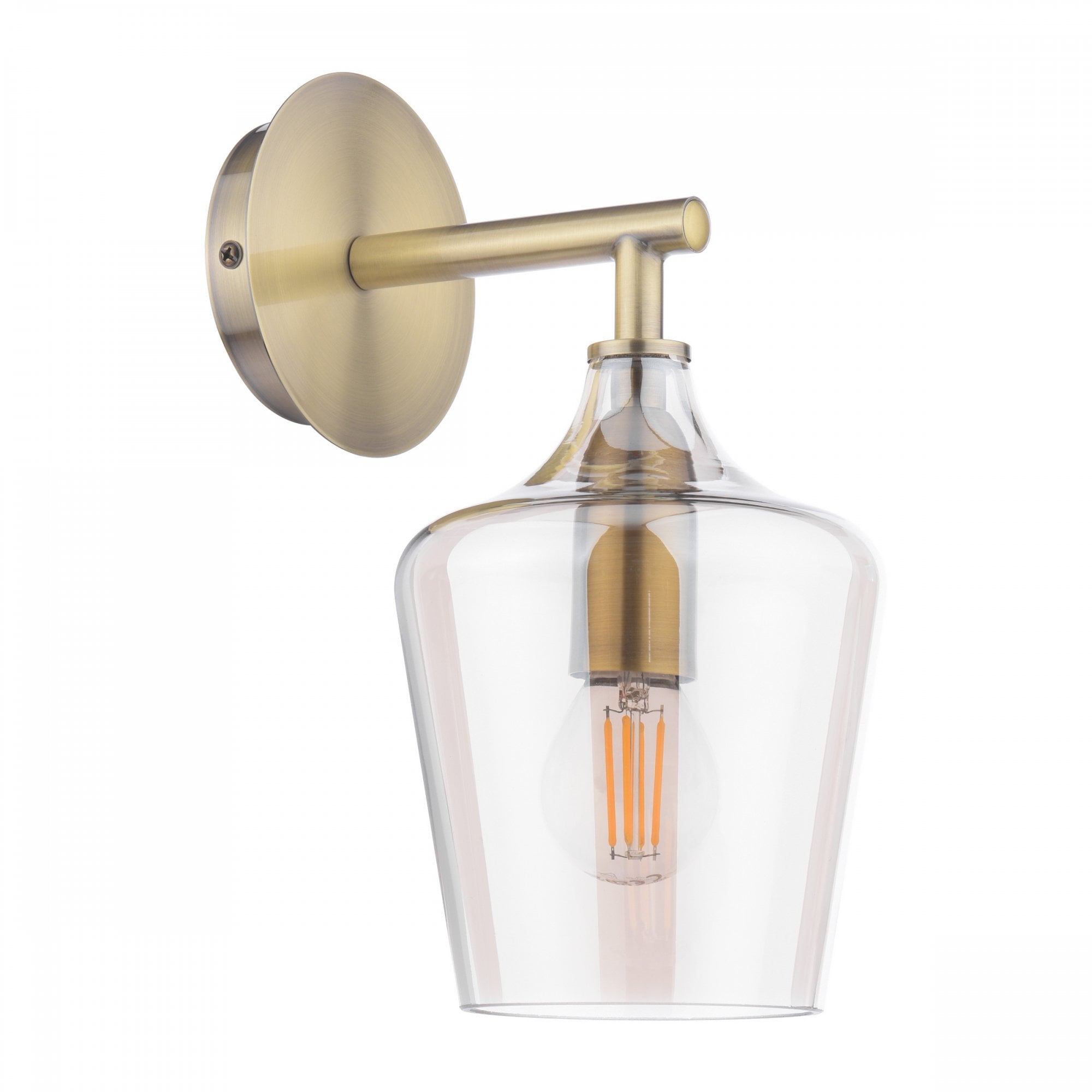 A brass wall light with a clear glass shade and a prominent filament LED bulb.